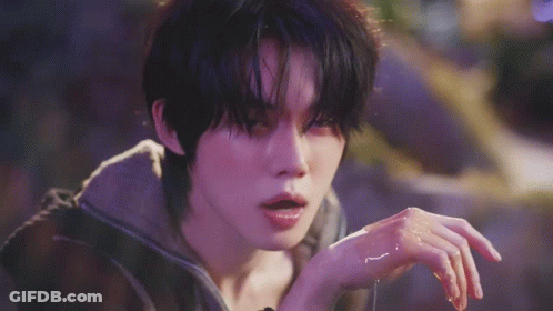 Person Touching Face On Purple Background GIF