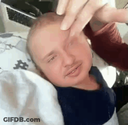 Person Touching Man's Forehead GIF