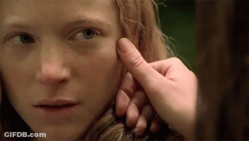 Person Touching Woman's Face With Finger GIF