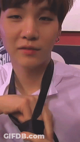 Person Tying A Tie GIF