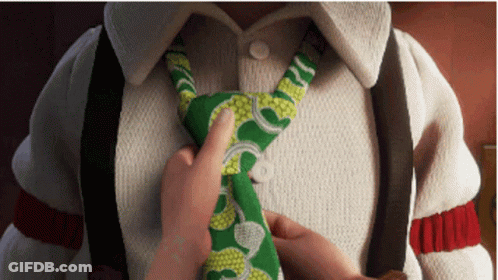 Person Tying Green And White Tie GIF