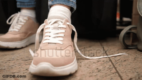 Person Tying Shoe Laces With Shutterstock GIF