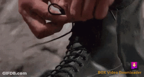 Person Tying Shoelaces With Box Video Downloader Logo GIF