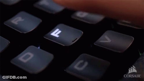 Person Typing Corsair Keyboard With Finger On D Key GIF