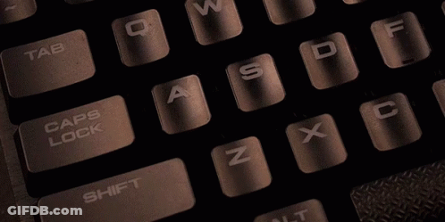 Person Typing On Keyboard With Caps Lock Highlighted GIF