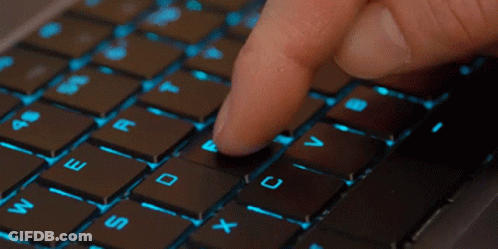 Person Typing On Keyboard With Finger On Shift Key GIF