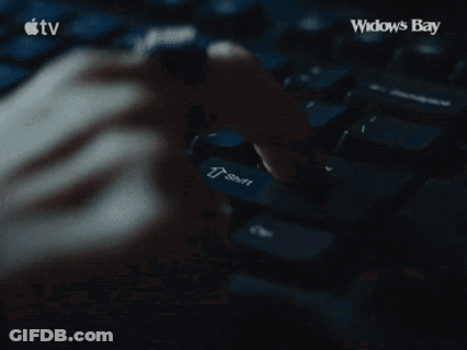 Person Typing On Keyboard With Widows Bay GIF