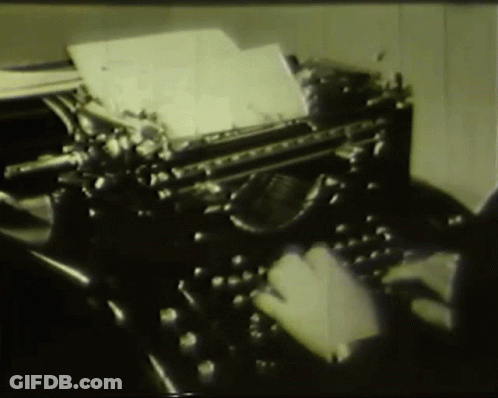 Person Typing On Old Typewriter With Paper GIF