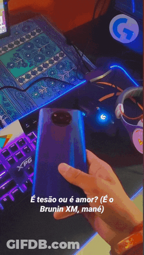Person Typing On XPG Keyboard Next To Computer Monitor GIF