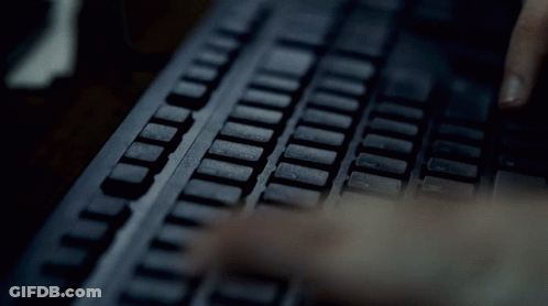 Person Typing T And L On Keyboard GIF