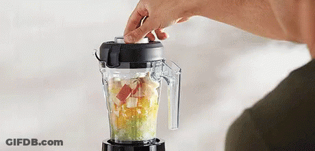 Person Using Blender To Make Smoothie With Fruit GIF