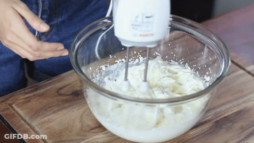 Person Using Bosch Mixer To Whip Cream GIF