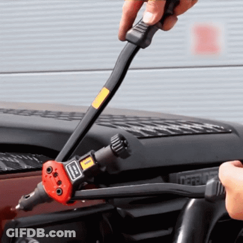 Person Using Rivet Gun With Simpson Sticker GIF