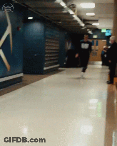 Person Walking Down Hallway GIF
