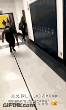 Person Walking Down Hallway Saying Ima Pull One Of These On You GIF