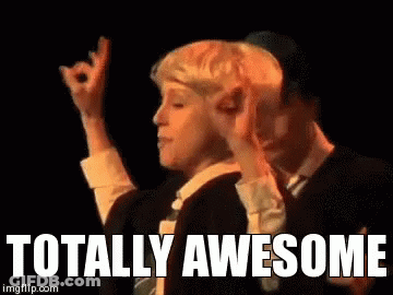 Person Walking Down Hospital Hallway With Exit Sign GIF