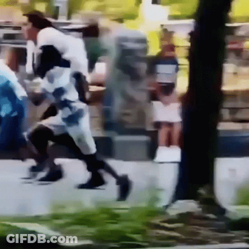Person Walking Down Street GIF