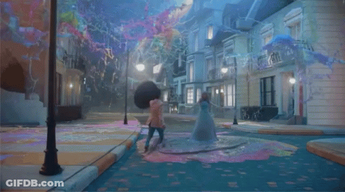 Person Walking Down Street With Bubbles And Buildings GIF