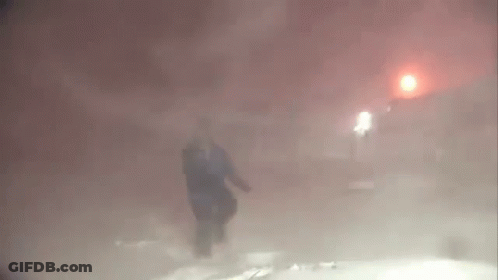 Person Walking Foggy Street At Night GIF