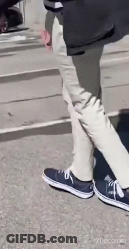 Person Walking In Blue Sneakers GIF