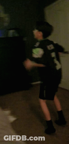 Person Walking In Dark Room With Red Star GIF