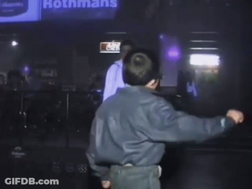 Person Walking In Front Of McDonalds Sign GIF