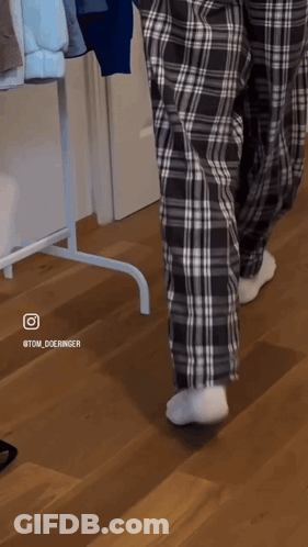 Person Walking In Plaid Pajama Pants And White Socks GIF