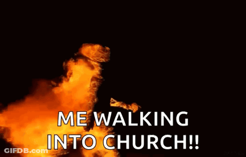 Person Walking Into Church With Flames GIF