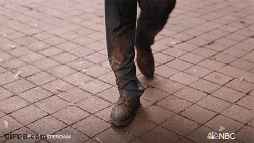 Person Walking On Brick Sidewalk With NBC GIF