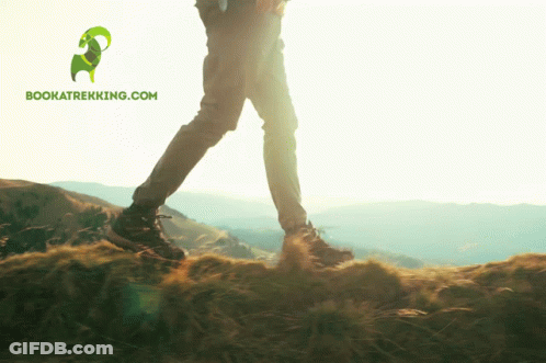 Person Walking On Hill With Bookatrekking.com Logo GIF