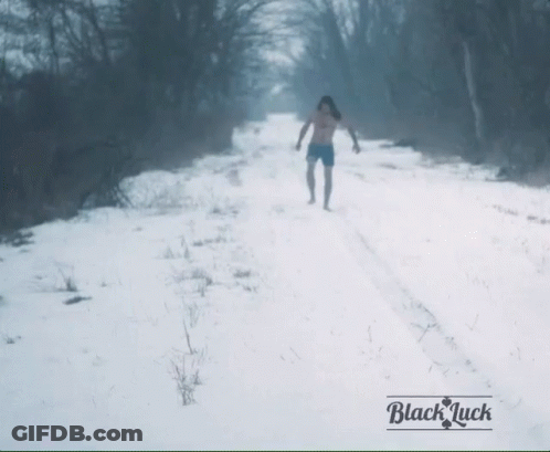 Person Walking On Snowy Road Black Luck GIF