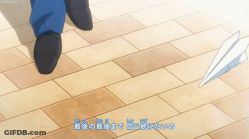 Person Walking On Tiled Floor With Chinese Writing GIF