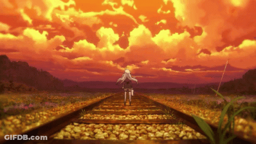 Person Walking On Tracks At Sunset GIF