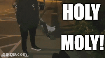 Person Walking Past Holy Moly Sign GIF