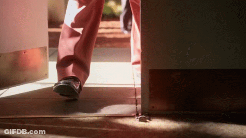 Person Walking Through Doorway GIF