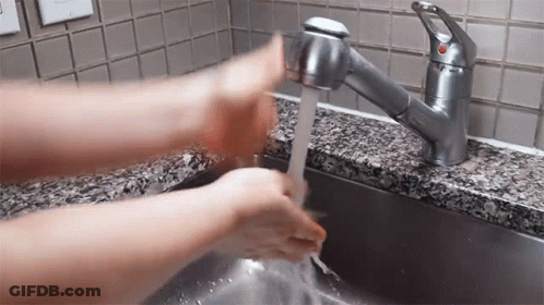 Person Washing Hands At Sink With Red Button GIF