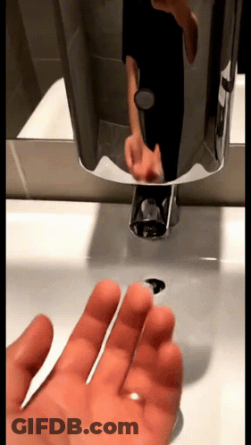 Person Washing Hands In Bathroom GIF