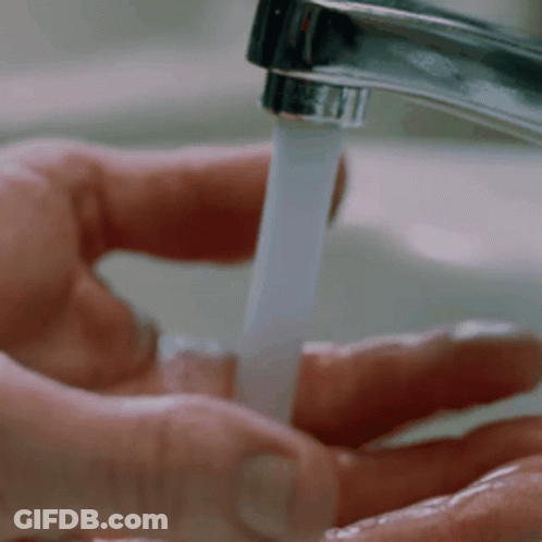 Person Washing Hands In Sink GIF