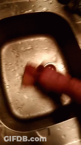 Person Washing With Red Sponge GIF