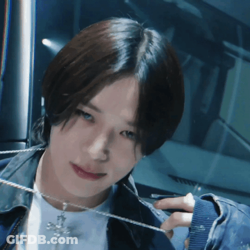 Person Wearing Cross Necklace GIF