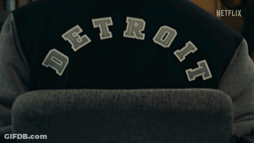 Person Wearing Detroit Varsity Jacket With Netflix Logo GIF