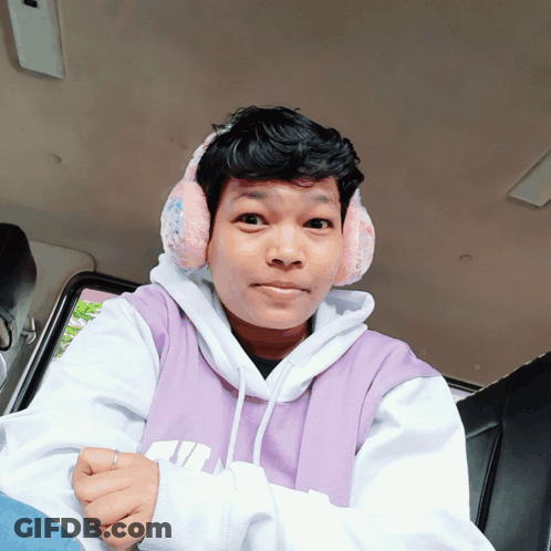 Person Wearing Ear Muffs And Purple Hoodie GIF