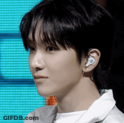 Person Wearing Earbuds GIF