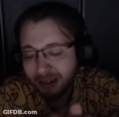 Person Wearing Glasses And Headphones Looking At Cell Phone GIF