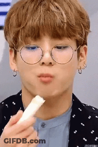 Person Wearing Glasses Eating Snack GIF