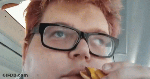 Person Wearing Glasses Eating Snack GIF
