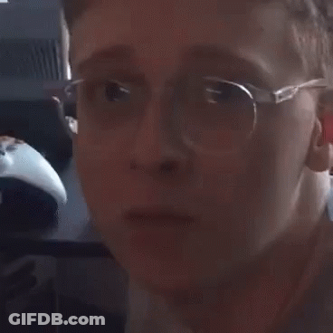Person Wearing Glasses Making A Face GIF