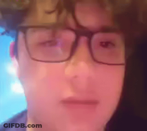 Person Wearing Glasses Making A Face GIF