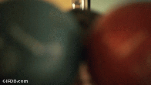 Person Wearing Glasses With Red Bowling Ball GIF