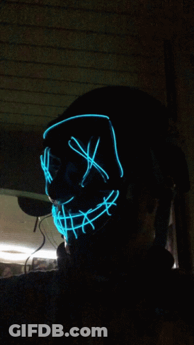Person Wearing Glowing Blue Mask GIF